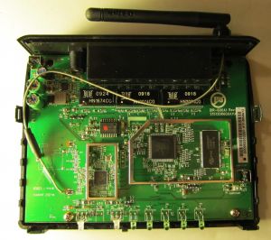 The D-Link DIR-600's board (w/ Plotech logo, lead-free logo, and 2151x P/N